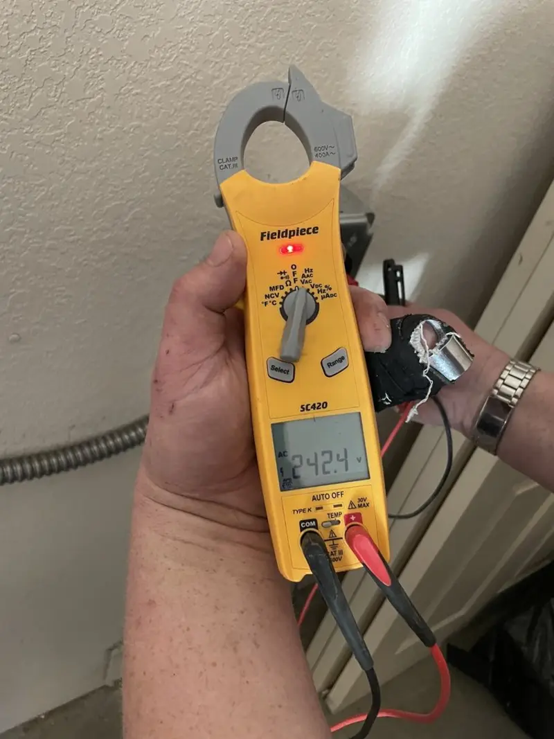 Voltage testing with clamp meter during Outlet Installation in Stanley